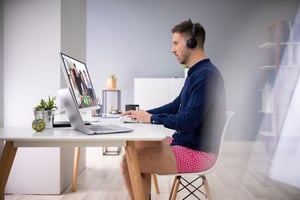 Man working remotely with a dress shirt and underwear on