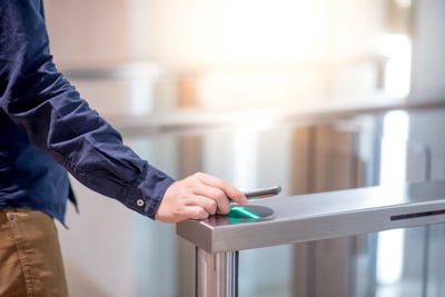 Employee using his smartphone to scan into his office