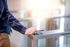 Employee using touchless visitor management system to enter a building