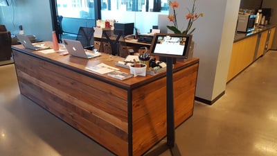 A queue management system to check visitors into an office