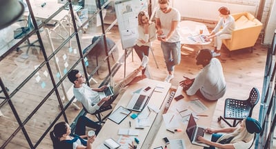 People collaborating in a shared workspace environment