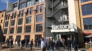 People walking in front of Factory coworking space entrance