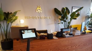A coworking space using a visitor registration app and kiosk