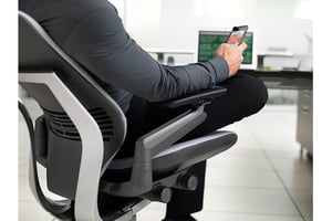 Office worker sitting in modern office chair