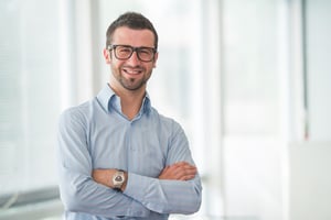 Smiling community manager in his coworking space