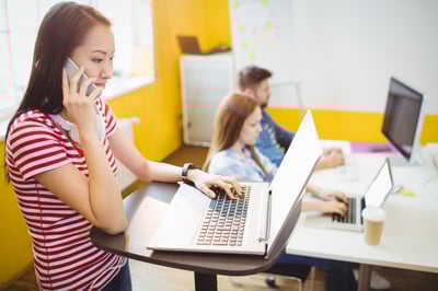 Smiling young professional in a modern coworking space