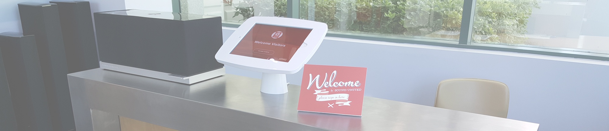 Visitor registration app welcomes visitors to a high tech company's reception area