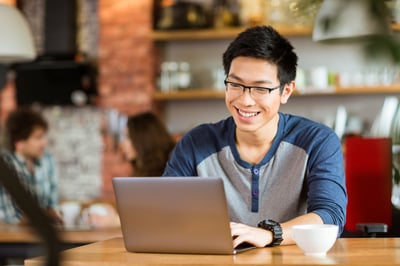 Employee working in a hybrid office coffee shop