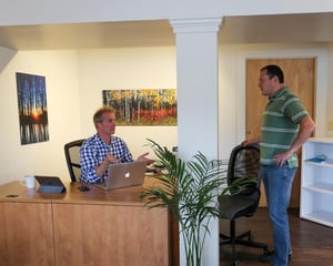 Corner Coworking owner Mark Eaton working with a member