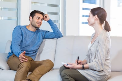 Happy mental health therapist and patient