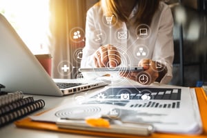 Woman using an iPad receptionist to manage her office