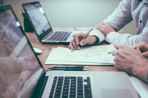 Two business people reviewing data in a modern office environment