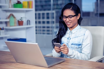 Businesswoman distracted by technology