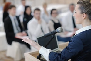 Woman presenting at an industry event