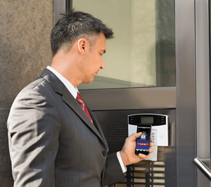 Visitor scanning ID at office access control system