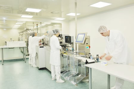 Employees using visitor management at a production plant