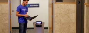 Futuristic office with visitor management software and robots