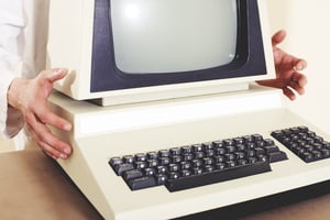 Early model personal computer with screen and keyboard