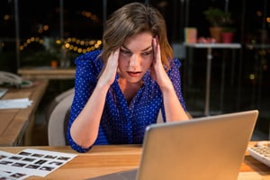 Frustrated employee wishes her office had a visitor registration kiosk