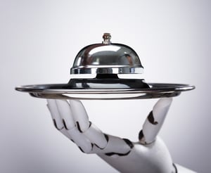 Robot waiter holding a bell