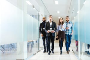 Startup workers walking through a coworking space