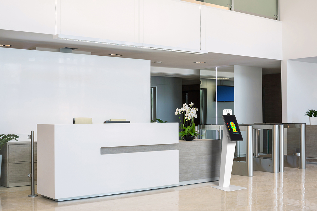 Visitor management kiosk being used for customer check-in