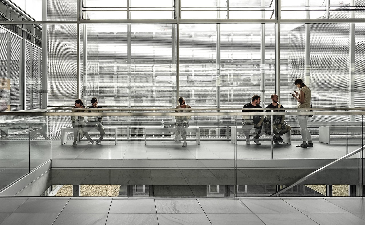 People-sitting-by-the-glass-window-building