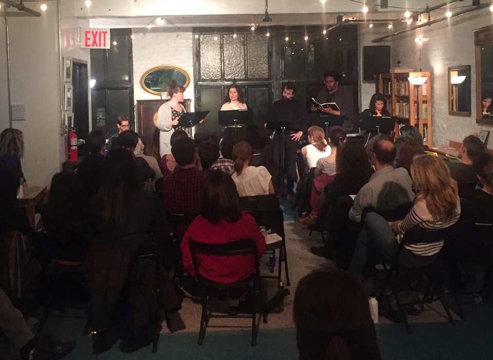 Choir performs in a shared workspace
