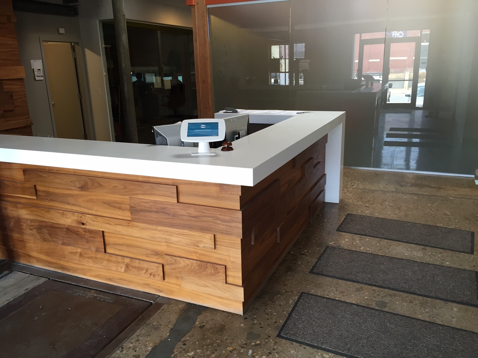 A visitor check-in app ensures guests are handled efficiently