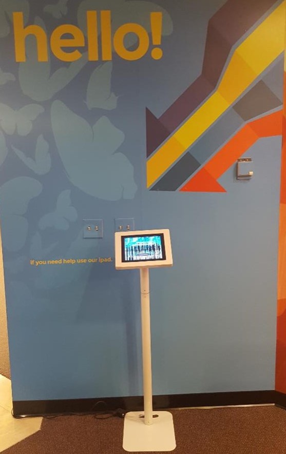 Greetly visitor check-in kiosk at a coworking space