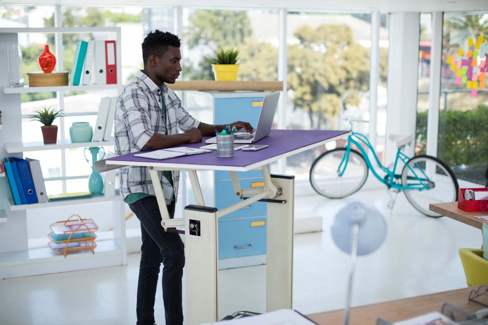 Employee workstation features modern office furniture