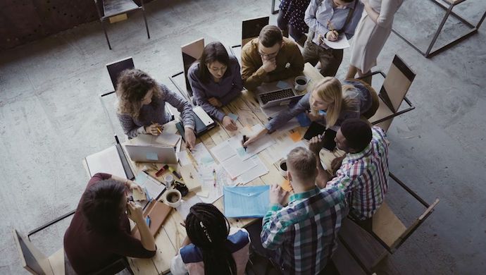 Millennials from a startup at a coworking table