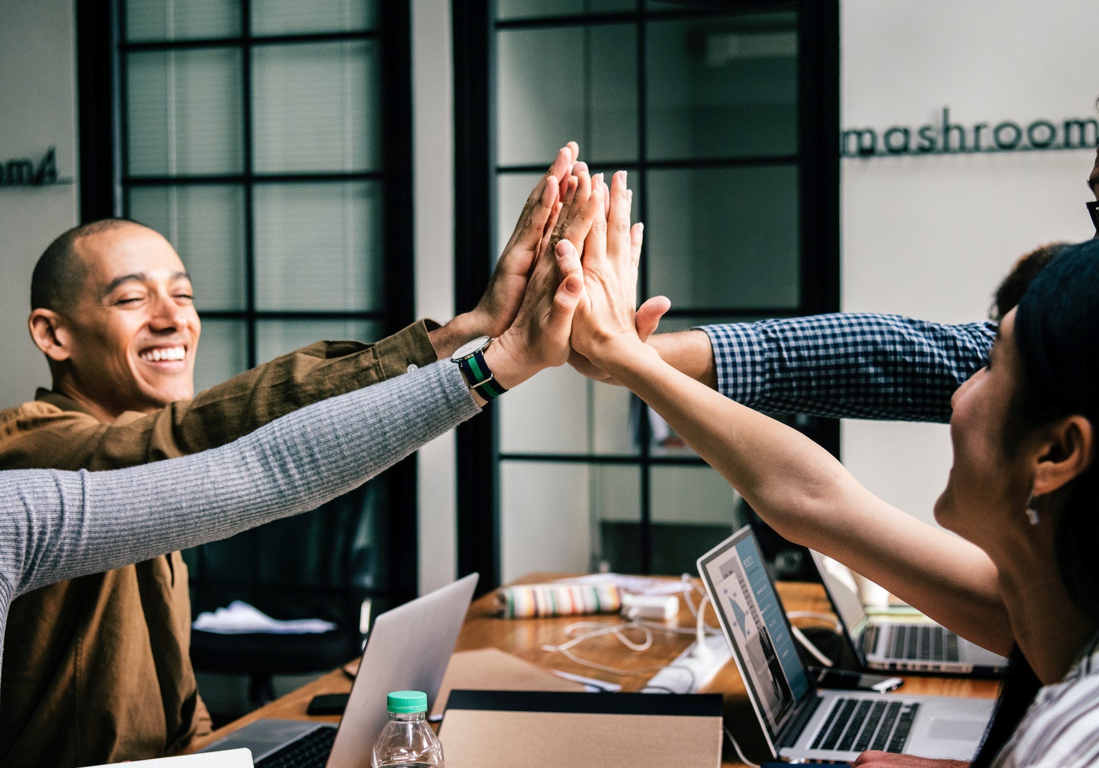 Worker celebrating in a coworking space